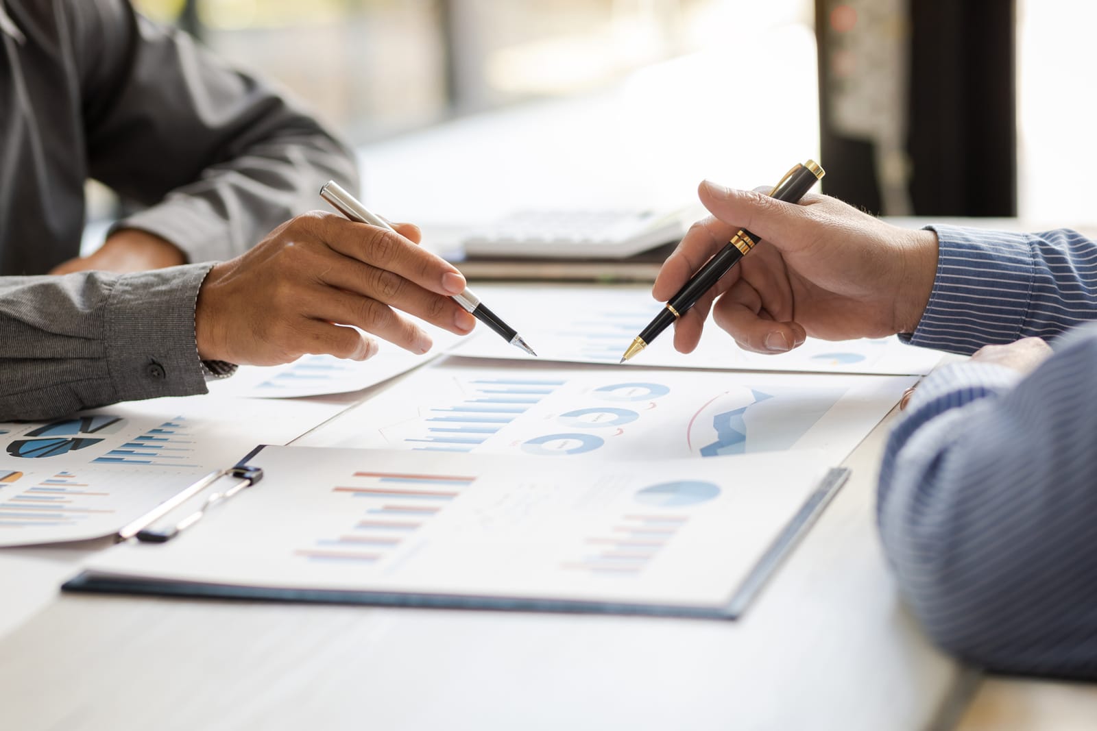 Advisors reviewing performance charts